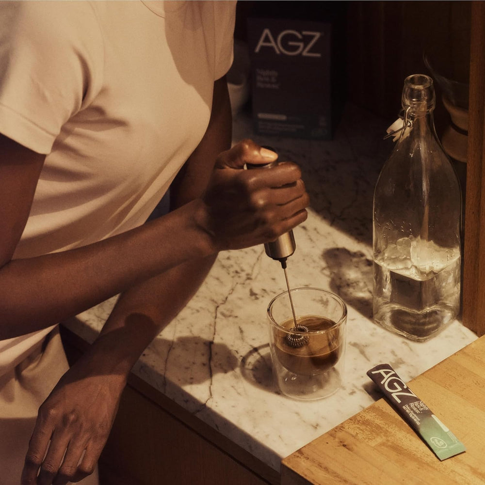 AG1 AGZ Sleep Drink scene showing a cozy night routine at home