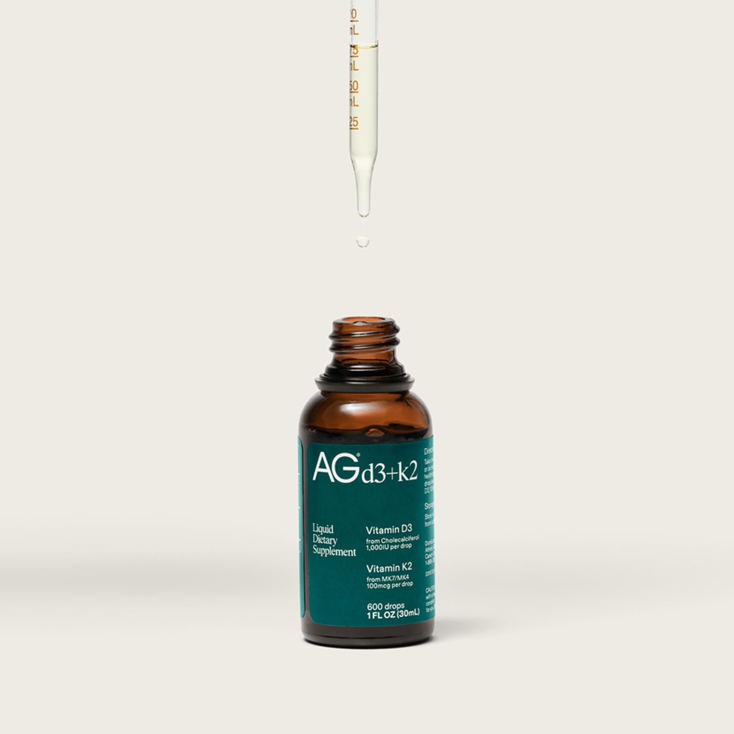 AG1 D3 K2 liquid formula label emphasizes high-potency delivery.