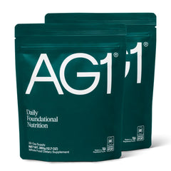 AG1 greens powder bottle front view with 2-pack for daily nutrition.