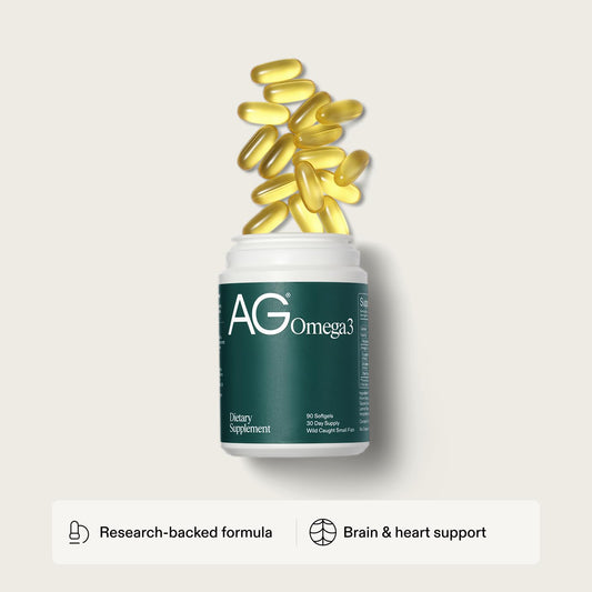 AG1 Omega-3 softgels pouring capsules for easy daily intake.