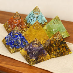 AierCrystal 7pcs pyramids resin glow under light for warm ambience.