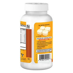 Airborne citrus flavored chewables dispensed from bottle on table