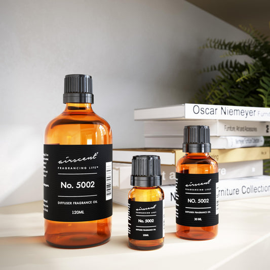 Air-Scent Creed Aventus-inspired diffuser oil close-up highlighting notes and label.