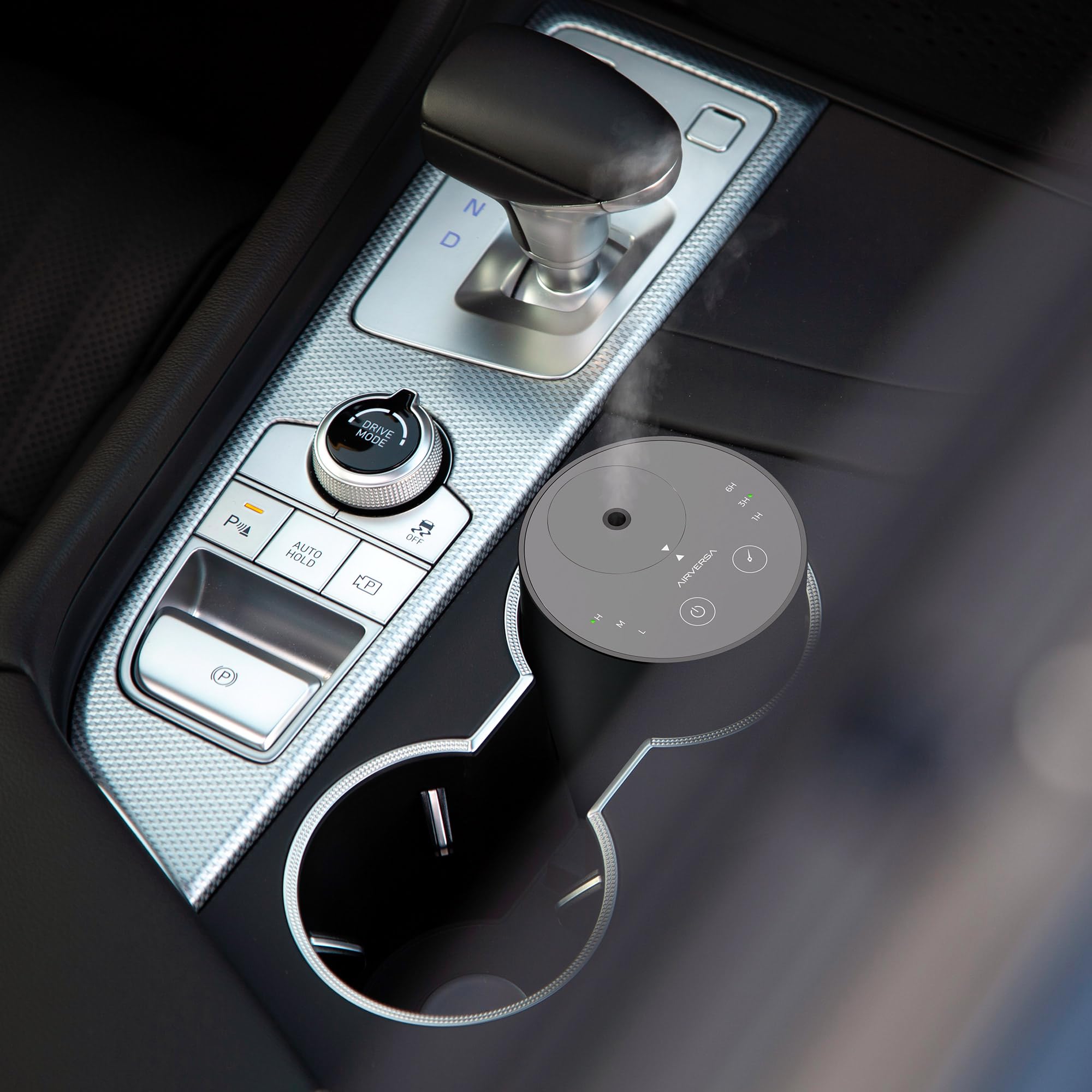Airversa ADX Black car diffuser in cup holder delivering secure, cordless aroma on the go.