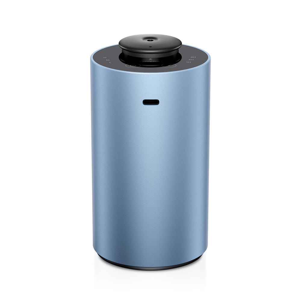 Airversa ANX diffuser in ice blue on tabletop delivering room-filling fragrance