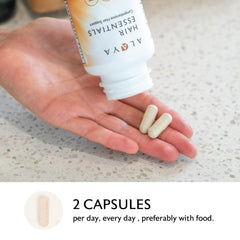 Alaya Naturals Hair Essentials capsules close-up emphasizes texture and coating for dosing.