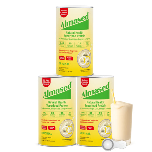Almased weight loss kit cans on kitchen counter for convenient meal replacement.