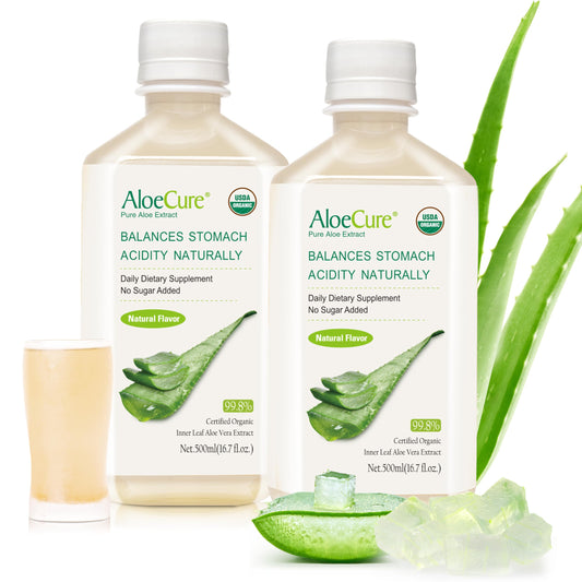 AloeCure bottle on a sunlit organic farm, signaling fresh source for quality aloe juice.