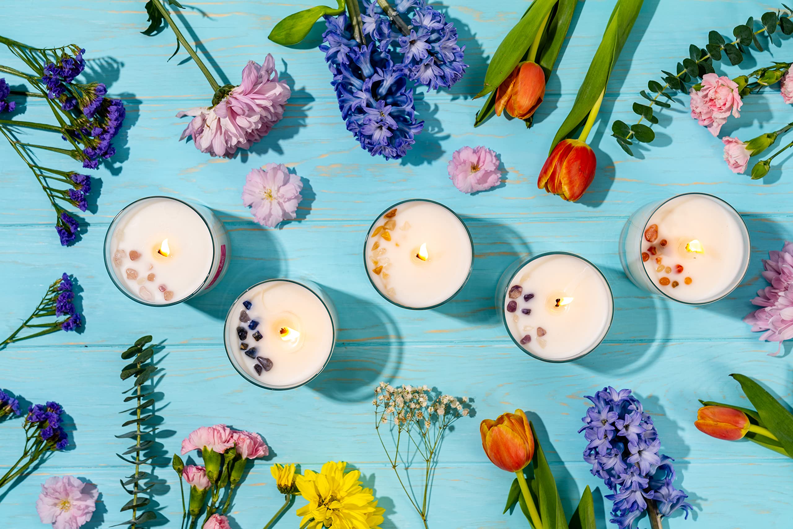 Crystal infused candle from Aluminate Life serves as decorative centerpiece.