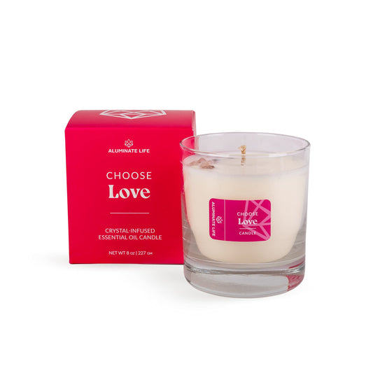 Aluminate Life luxury candle with rose quartz crystals embedded for calming ambience.