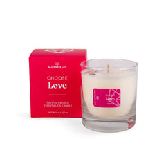 Aluminate Life luxury candle with rose quartz crystals embedded for calming ambience.