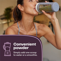 Glass of smoothie made with Amazing Grass Greens Blend and fruit for a balanced snack.