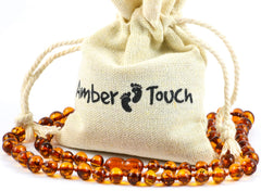 Amber Touch Baltic Amber Necklace closeup beads showing natural warmth and rounded shape.