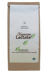 Closeup of American Anti Aging Magnesium Lactate capsules in a bottle