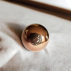 American Ayurveda copper ball grounding energy to balance body and mind.