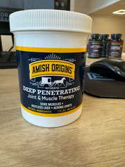 Amish Origins ointment close-up shows thick, rich texture for lasting comfort.