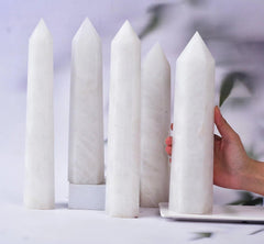 AMOYSTONE crystal wand resting on a desk for meditation and focus