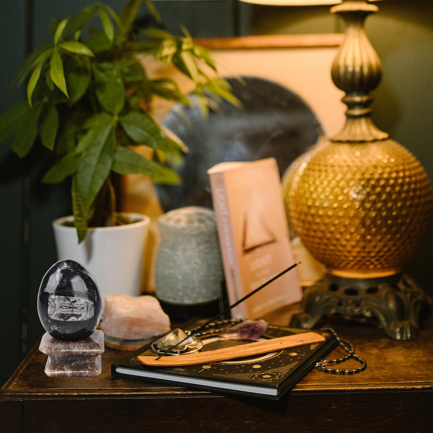 Amoystone crystal egg in meditation setup for focus and serenity