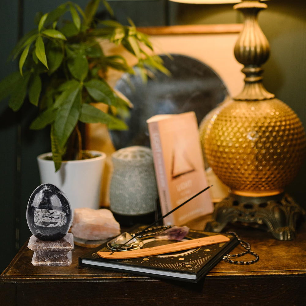 Amoystone crystal egg in meditation setup for focus and serenity