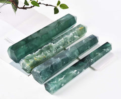 AMOYSTONE green fluorite obelisk wand in a calm room decor setting