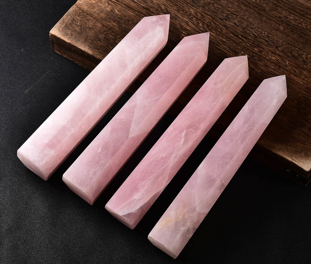 AMOYSTONE hand-polished rose quartz wand offers warm tactile serenity.