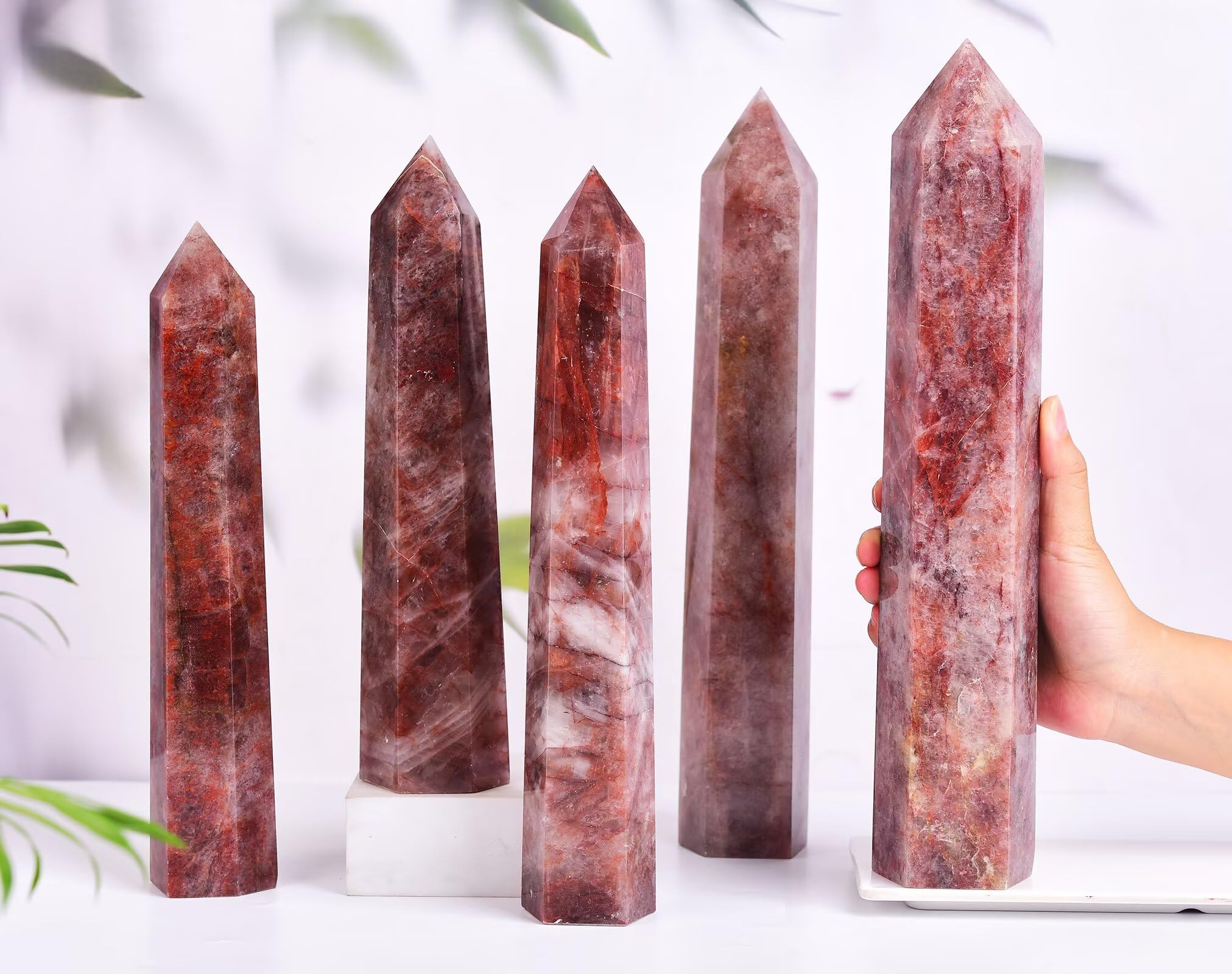 AMOYSTONE Hematoid Quartz wand on desk enhances room ambiance and focus.