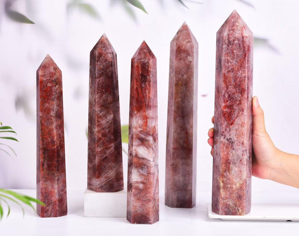 AMOYSTONE Hematoid Quartz wand on desk enhances room ambiance and focus.