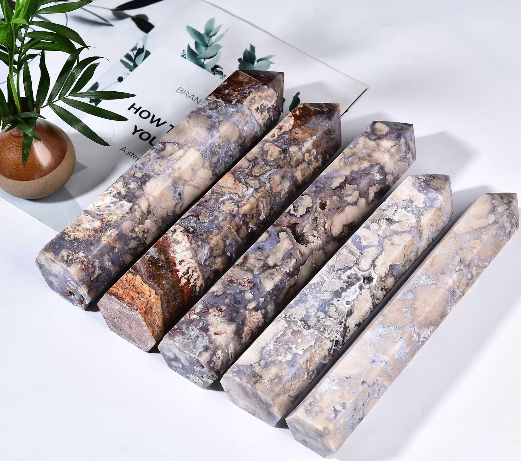 AMOYSTONE Blue Flower Agate Wand closeup emphasizes the polished surface and energy flow.