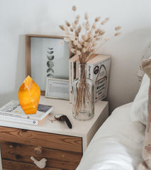 AMOYSTONE orange fluorite tower in a meditation space promoting mindful focus.