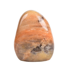 AMOYSTONE Peach Moonstone ornament on polished crystal tower for elegant display and calm ambiance.