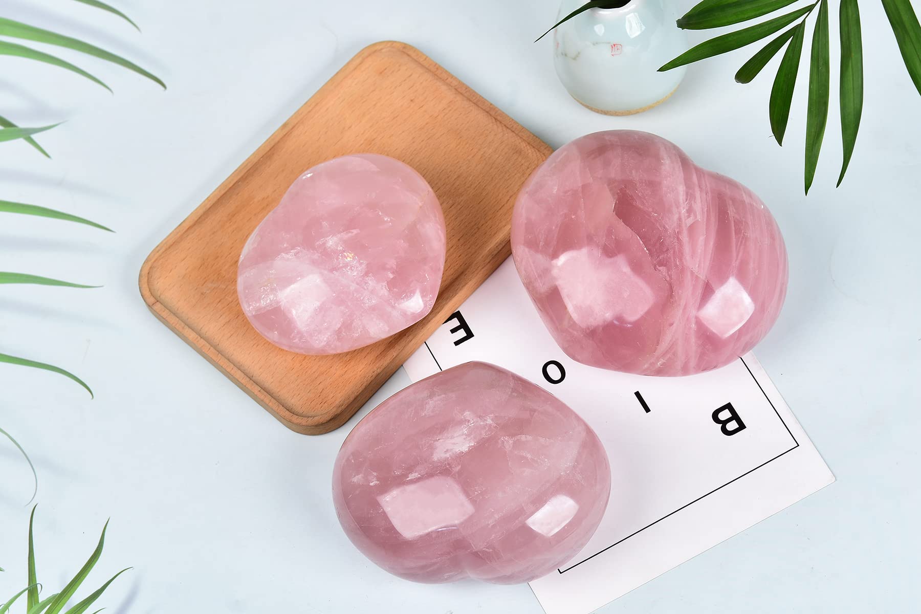 AMOYSTONE rose quartz heart shows natural color variations and texture.