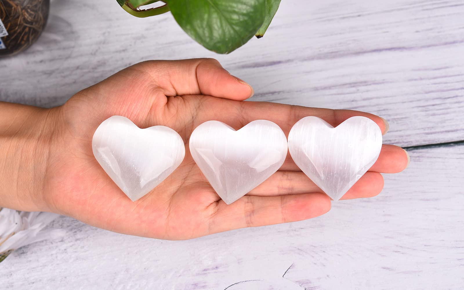 AMOYSTONE selenite heart decor creates a protective aura in living spaces.