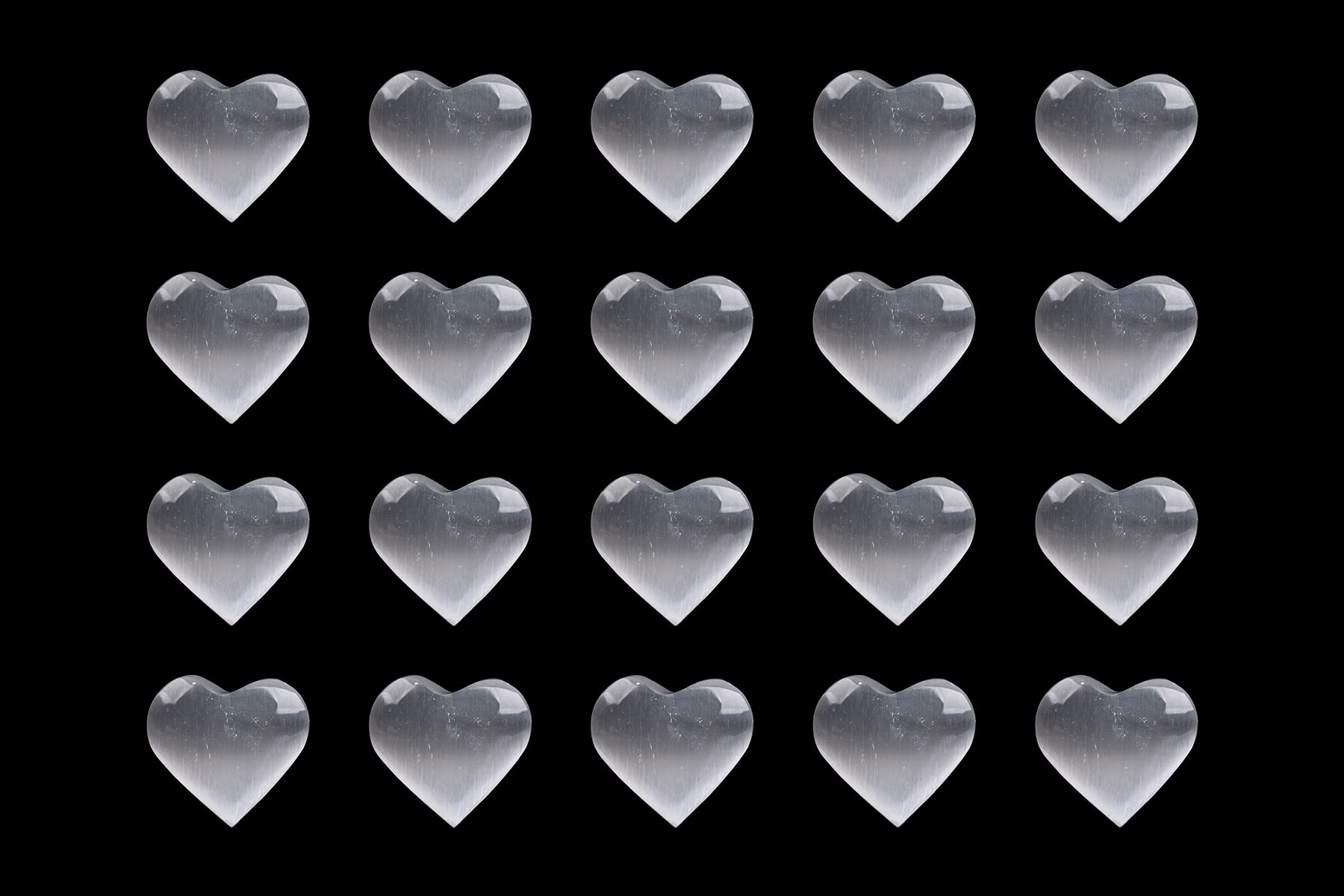 AMOYSTONE pocket-size selenite heart stone fits in hand for on-the-go balance.