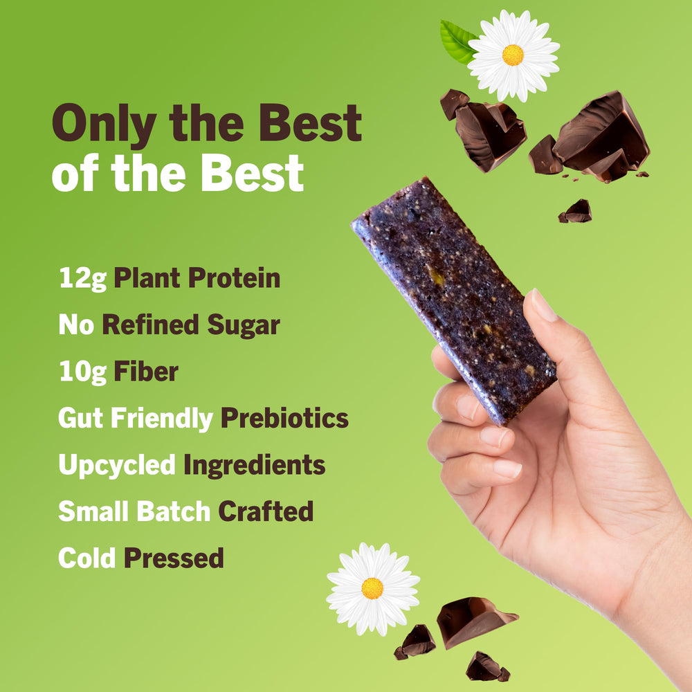 Amrita bar held in hand, a convenient snack between meetings or workouts.