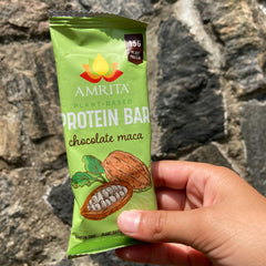 Amrita ingredients close-up shows dates, coconut, chia, cacao for wholesome flavor.