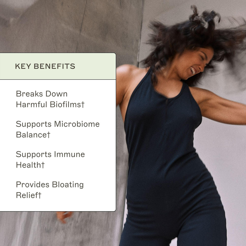 Amy Myers MD Biofilm Disruptor on kitchen counter with produce for everyday gut wellness