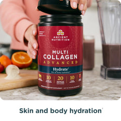 Ancient Nutrition Advanced Multi Collagen Hydrate powder dissolved in water with berry hue