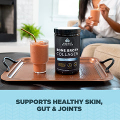 Ancient Nutrition Bone Broth Collagen Vanilla powder scoop ready for mixing