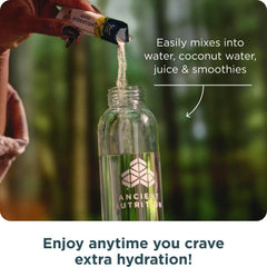 Ancient Nutrition lemon lime dissolved in water in a glass for refreshing hydration.