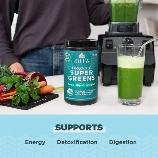 Ancient Nutrition Super Greens powder scoop ready to mix into water.