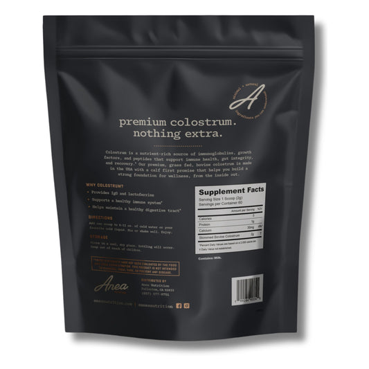 Anea Nutrition Colostrum Unflavored scoop ready for easy daily dosing.
