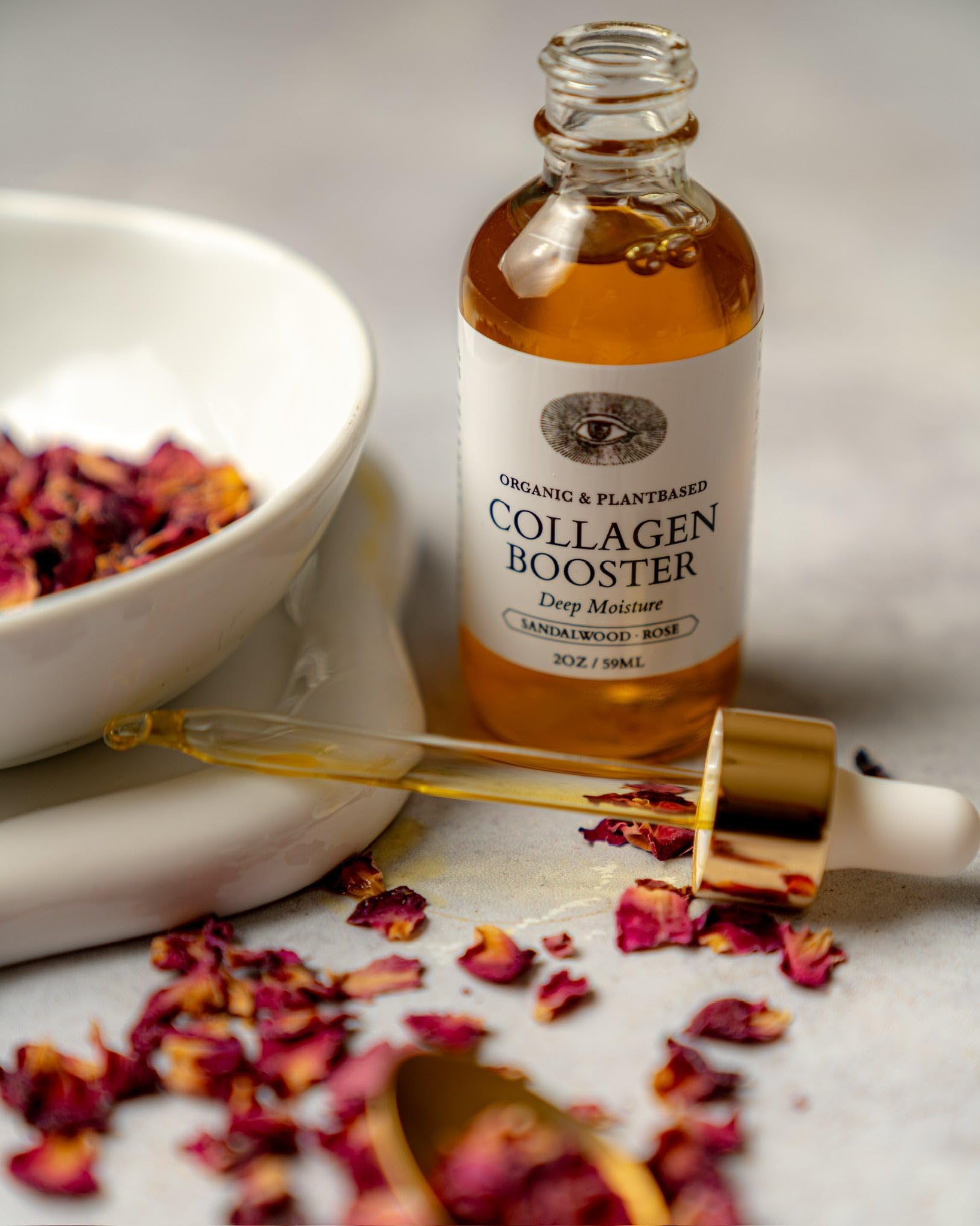 Anima Mundi Collagen Booster Oil application featuring rose infusion