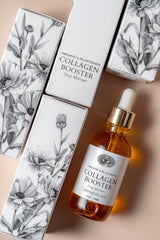 Anima Mundi Collagen Booster Oil with rose petals in a glass dropper