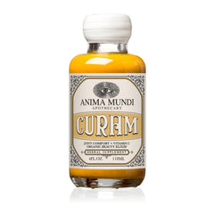Anima Mundi Curam elixir bottle poured for a morning tea ritual