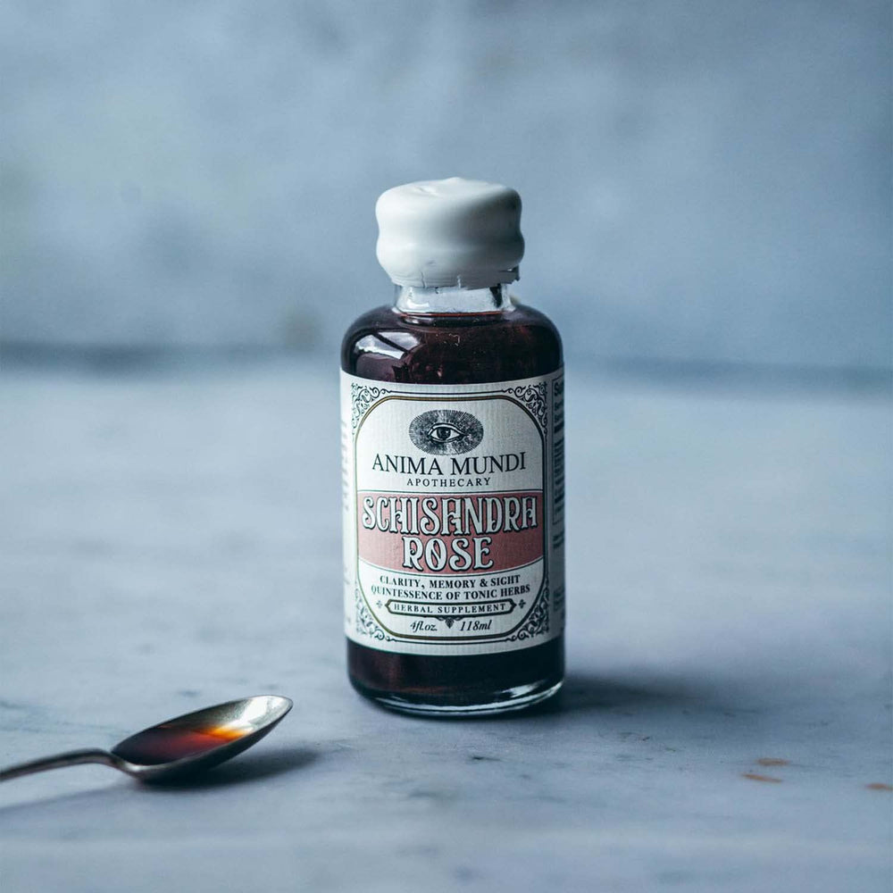 Close-up of schizandra berries in Anima Mundi Elixir, an adaptogenic blend