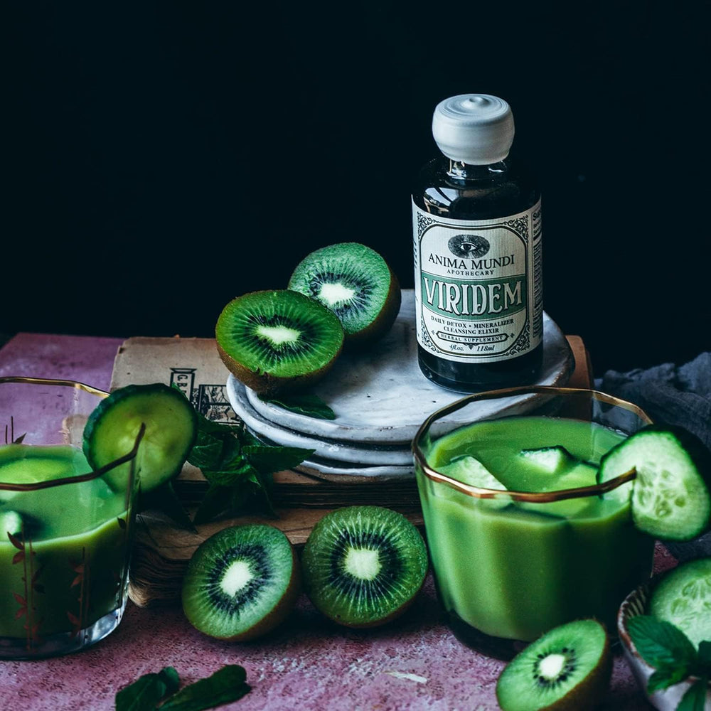 Anima Mundi Apothecary Viridem Greens Detox Elixir in a glass with vibrant color.