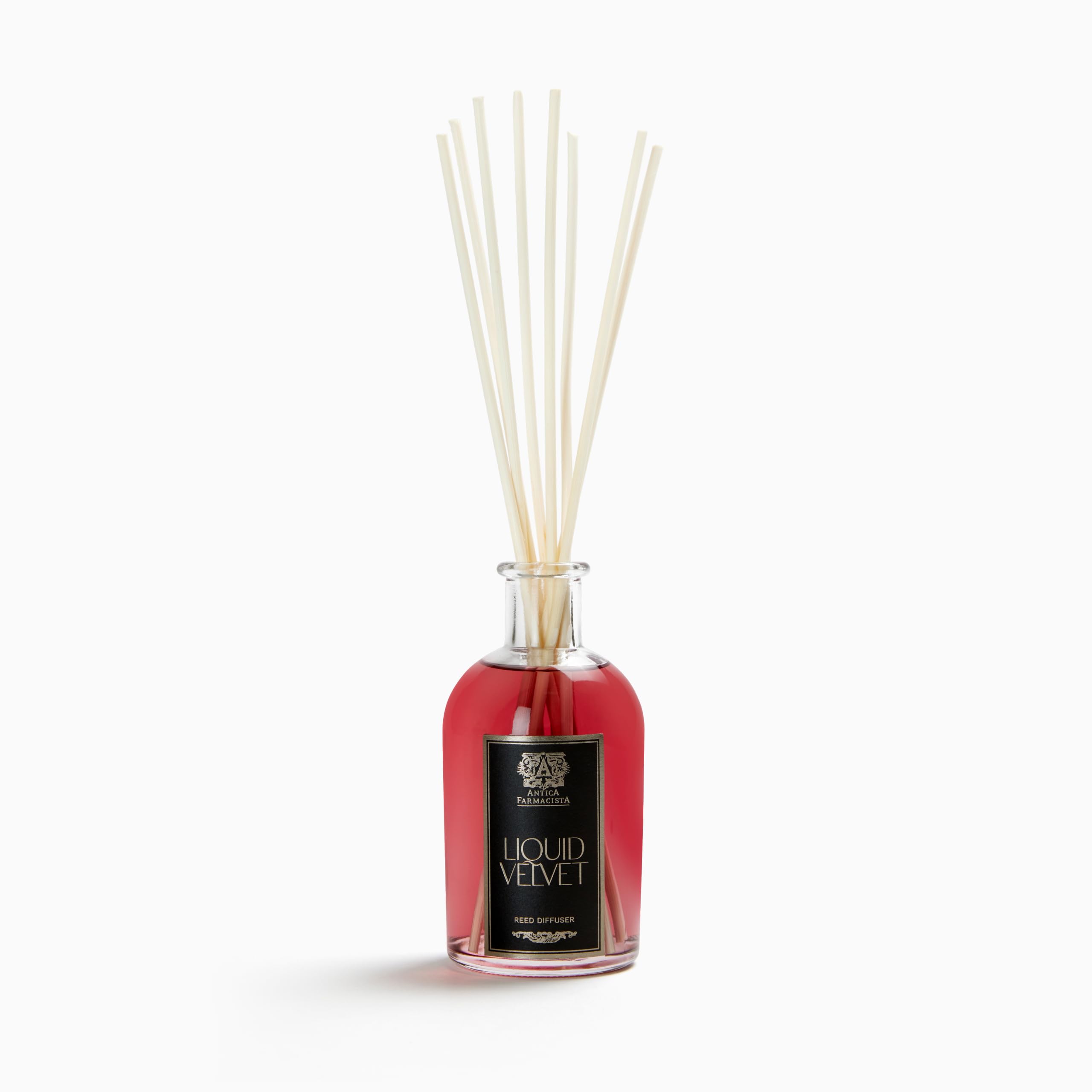 Antica Farmacista home ambiance diffuser bottle releasing a long-lasting fragrance in a living room.