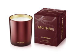 APOTHEKE Bitter Cherry candle in a red jar creates a warm, inviting space.