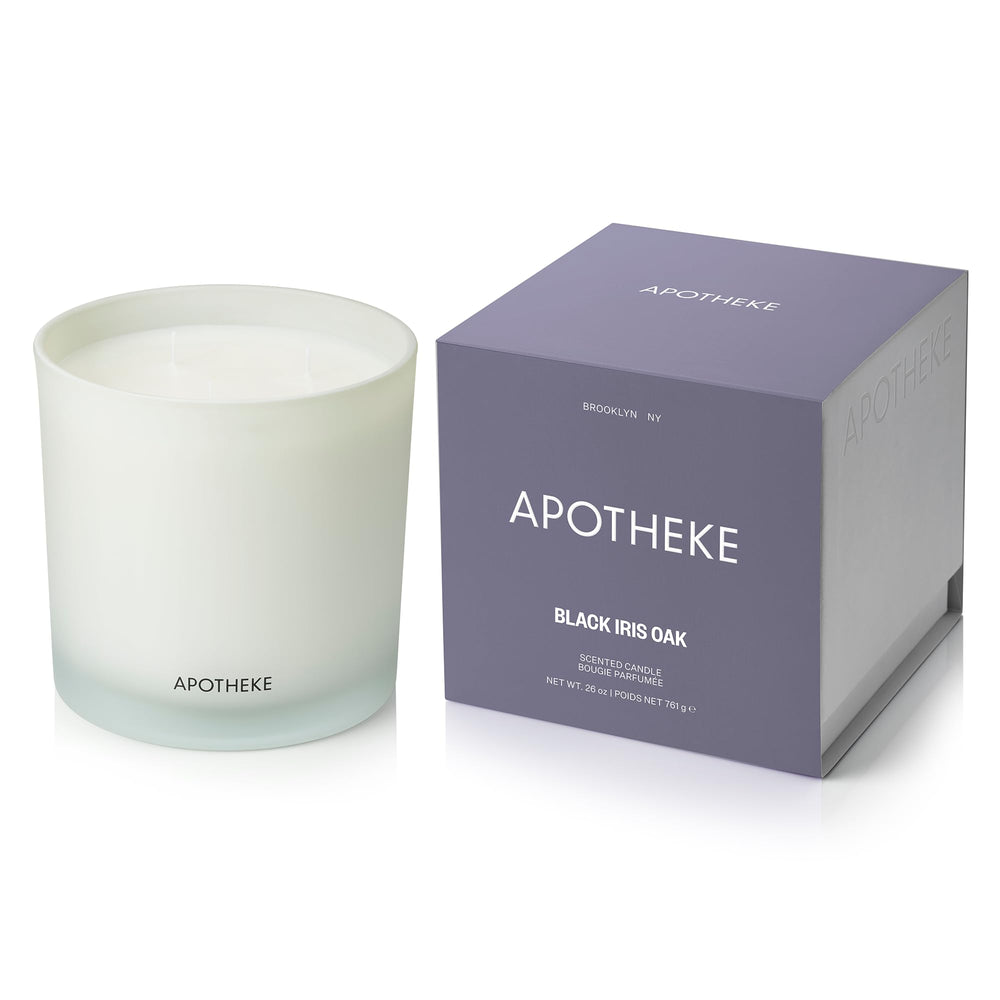 APOTHEKE Black Iris Oak candle in glass jar enhances ambiance with premium fragrance.