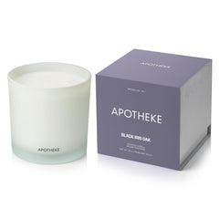 APOTHEKE Black Iris Oak candle in glass jar enhances ambiance with premium fragrance.